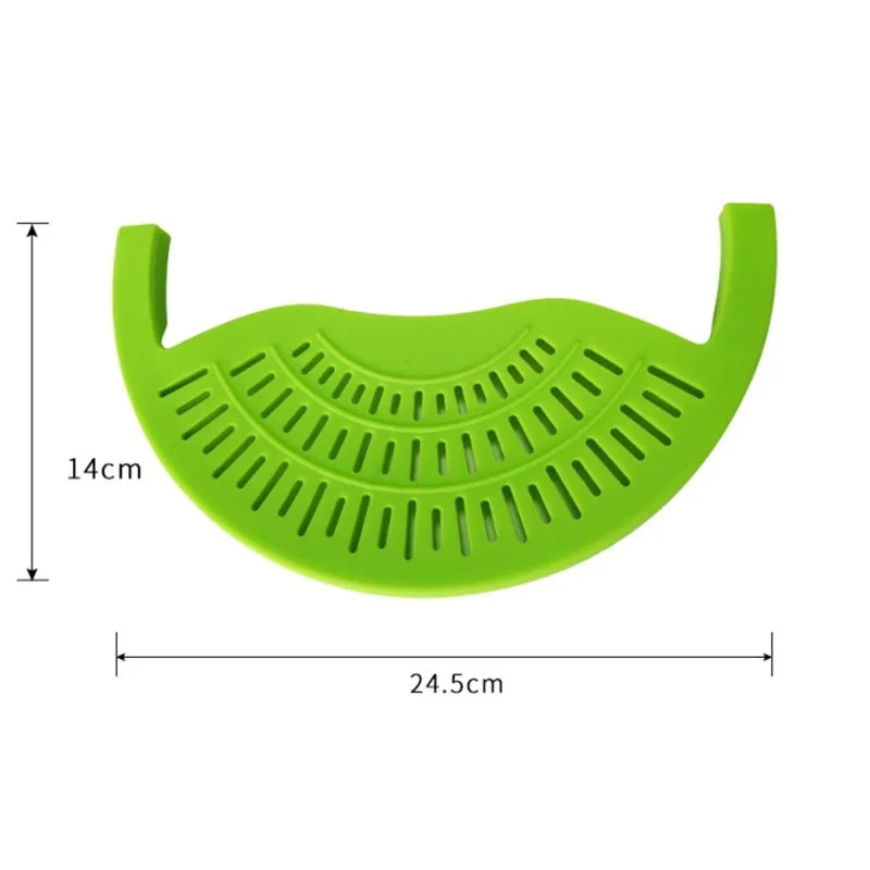 Black silicone food oil drainer snapped onto a pot rim, with liquid being poured off
