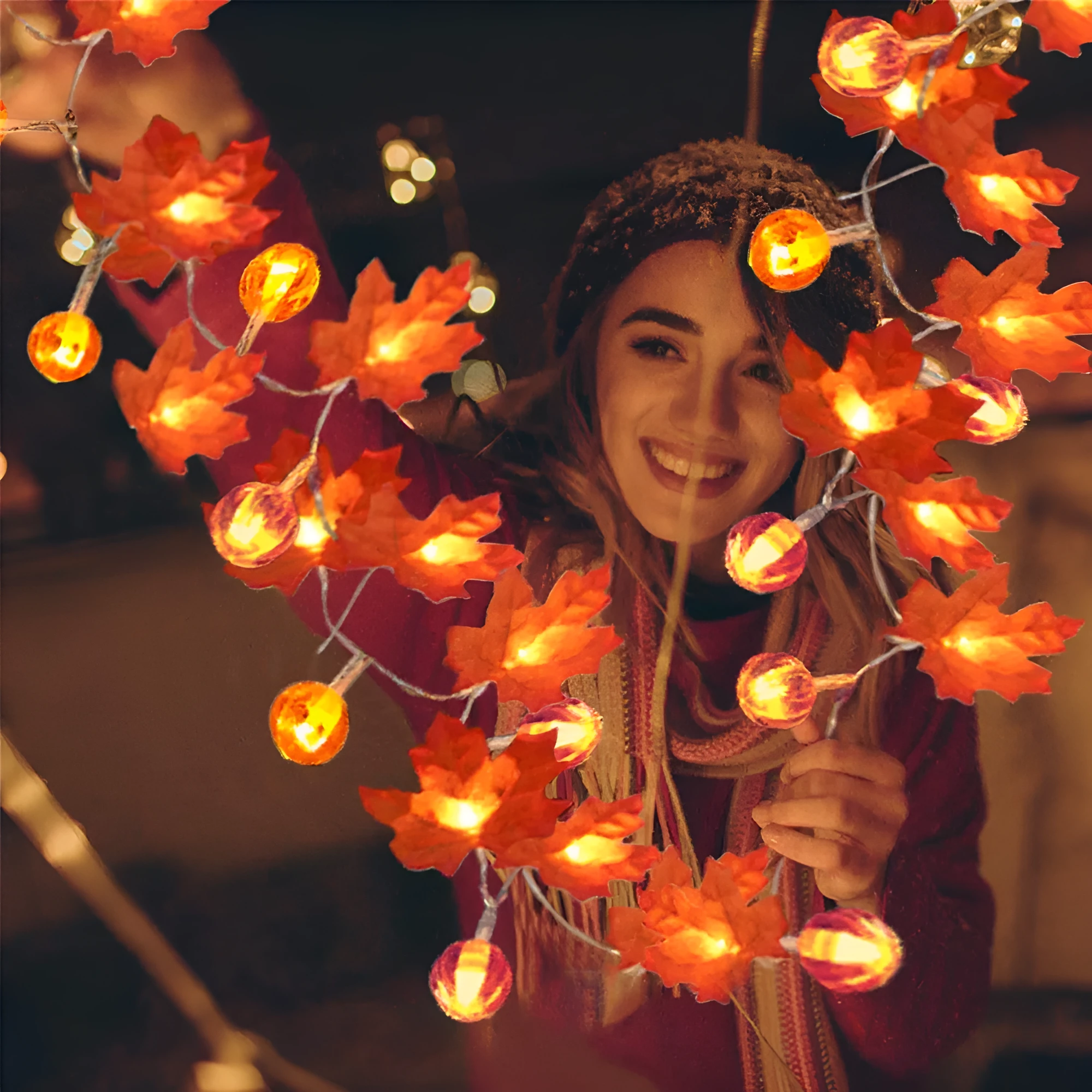 Halloween pumpkin and maple leaf LED light string on a dark background, with warm white 3000K glow