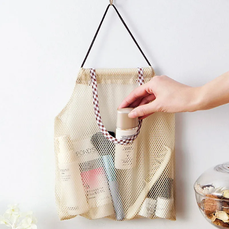 Beige plaid polyester mesh storage bag with cotton rope handles measuring 26x29cm