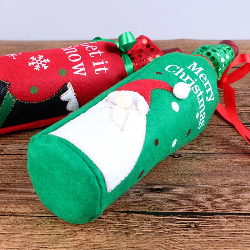 Red and green Christmas cloth wine bottle covers with festive designs on standard wine bottles