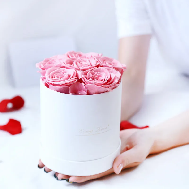 Handmade everlasting rose in hug bucket with preserved flower material, available in white red pink black blue colours