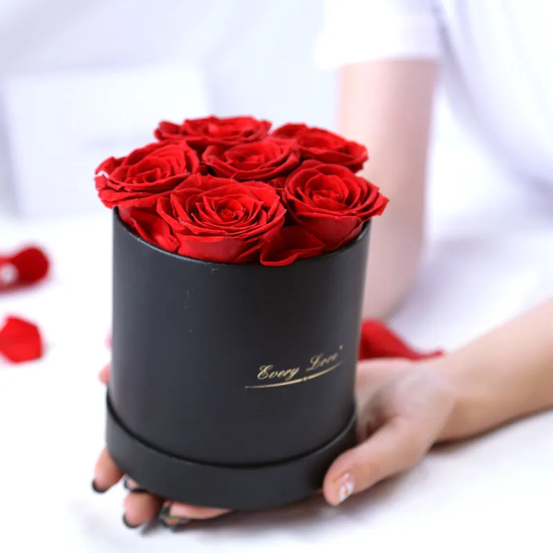 Handmade everlasting rose in hug bucket with preserved flower material, available in white red pink black blue colours