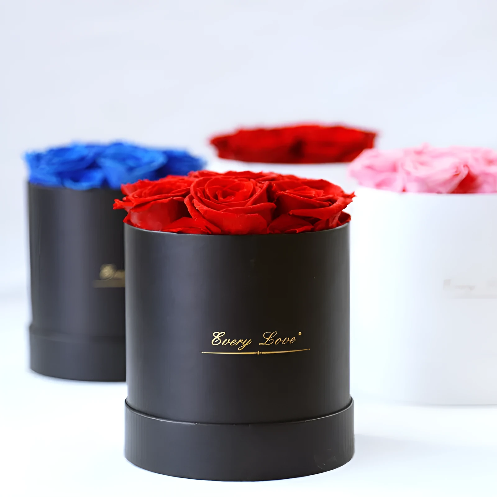 Handmade everlasting rose in hug bucket with preserved flower material, available in white red pink black blue colours