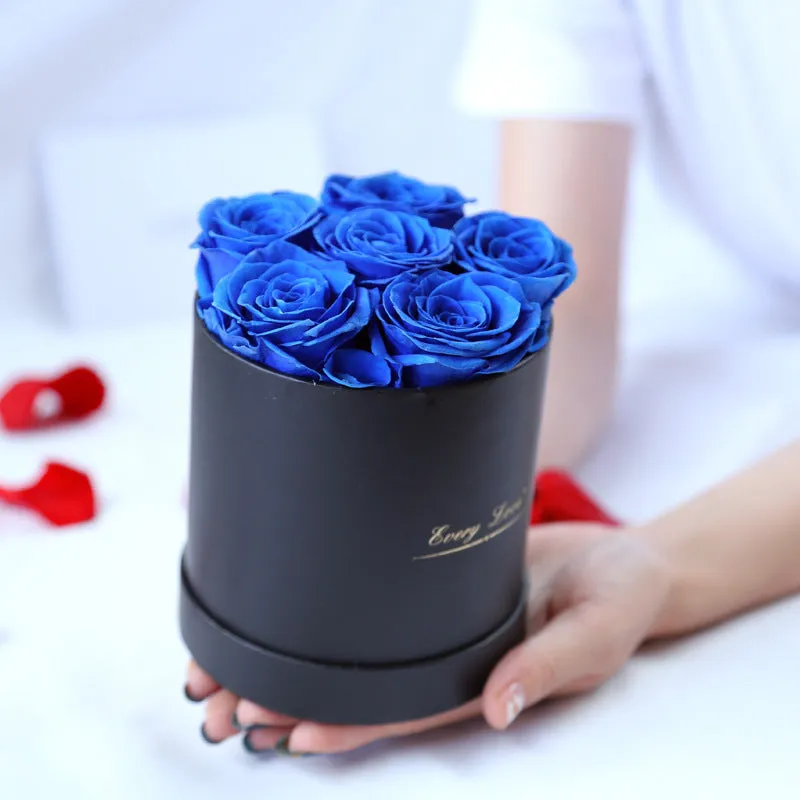 Handmade everlasting rose in hug bucket with preserved flower material, available in white red pink black blue colours