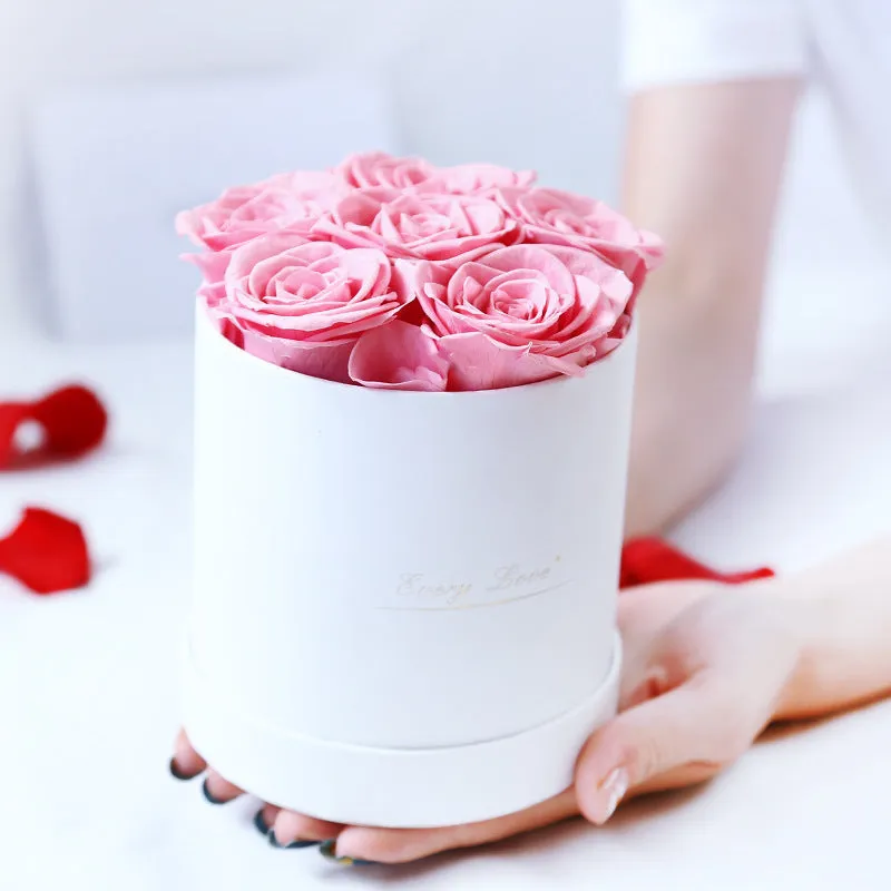Handmade everlasting rose in hug bucket with preserved flower material, available in white red pink black blue colours