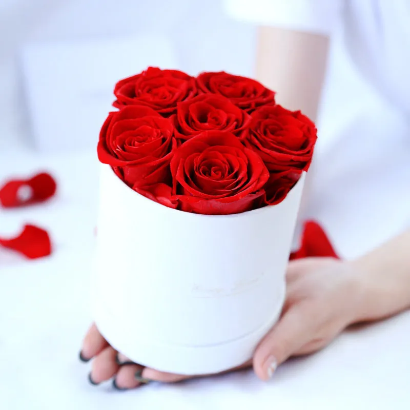Handmade everlasting rose in hug bucket with preserved flower material, available in white red pink black blue colours