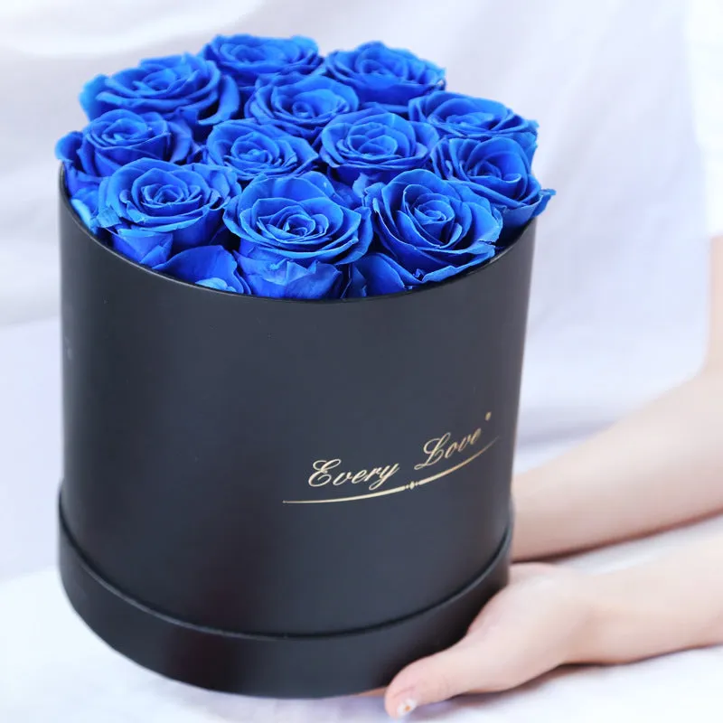 Handmade everlasting rose in hug bucket with preserved flower material, available in white red pink black blue colours