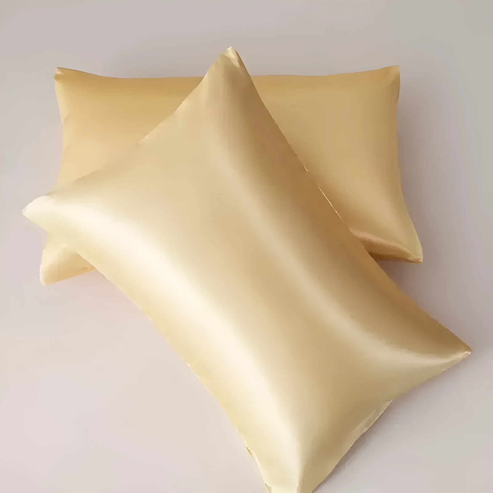 A pair of solid colour satin cloth pillowcases in a choice of thirteen colours including navy blue and rose red.