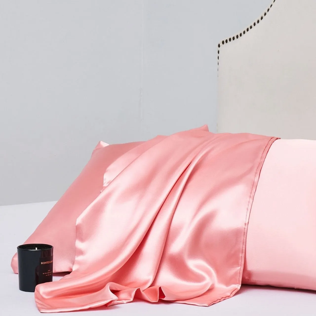 A pair of solid colour satin cloth pillowcases in a choice of thirteen colours including navy blue and rose red.