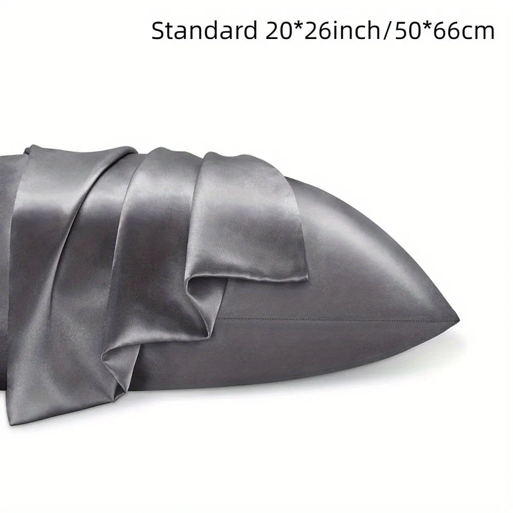 A pair of solid colour satin cloth pillowcases in a choice of thirteen colours including navy blue and rose red.