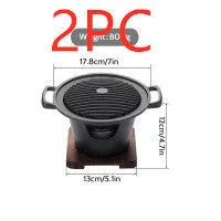 Mini BBQ grill alcohol stove with double-head flame and non-stick plate on tabletop