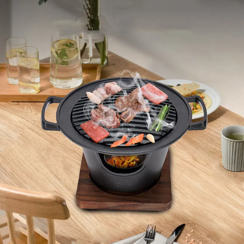 Mini BBQ grill alcohol stove with double-head flame and non-stick plate on tabletop