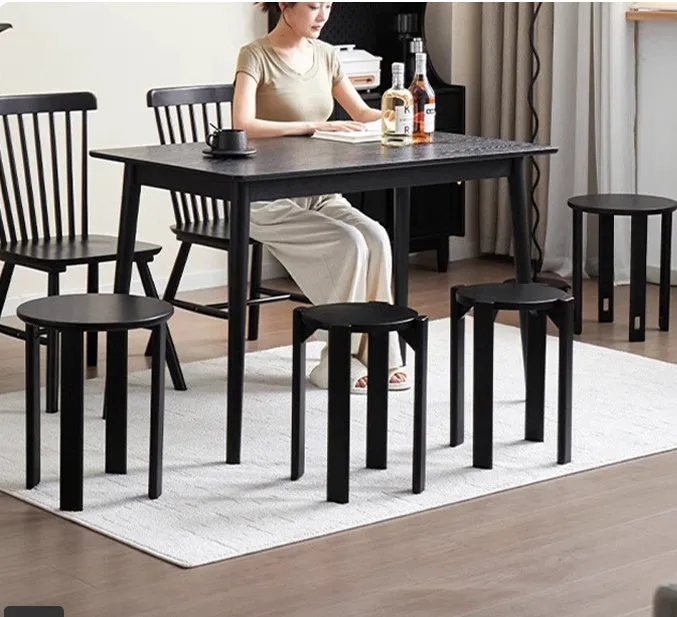 Stackable iron round dining stool in cream colour, showing clean lines and sturdy metal frame.