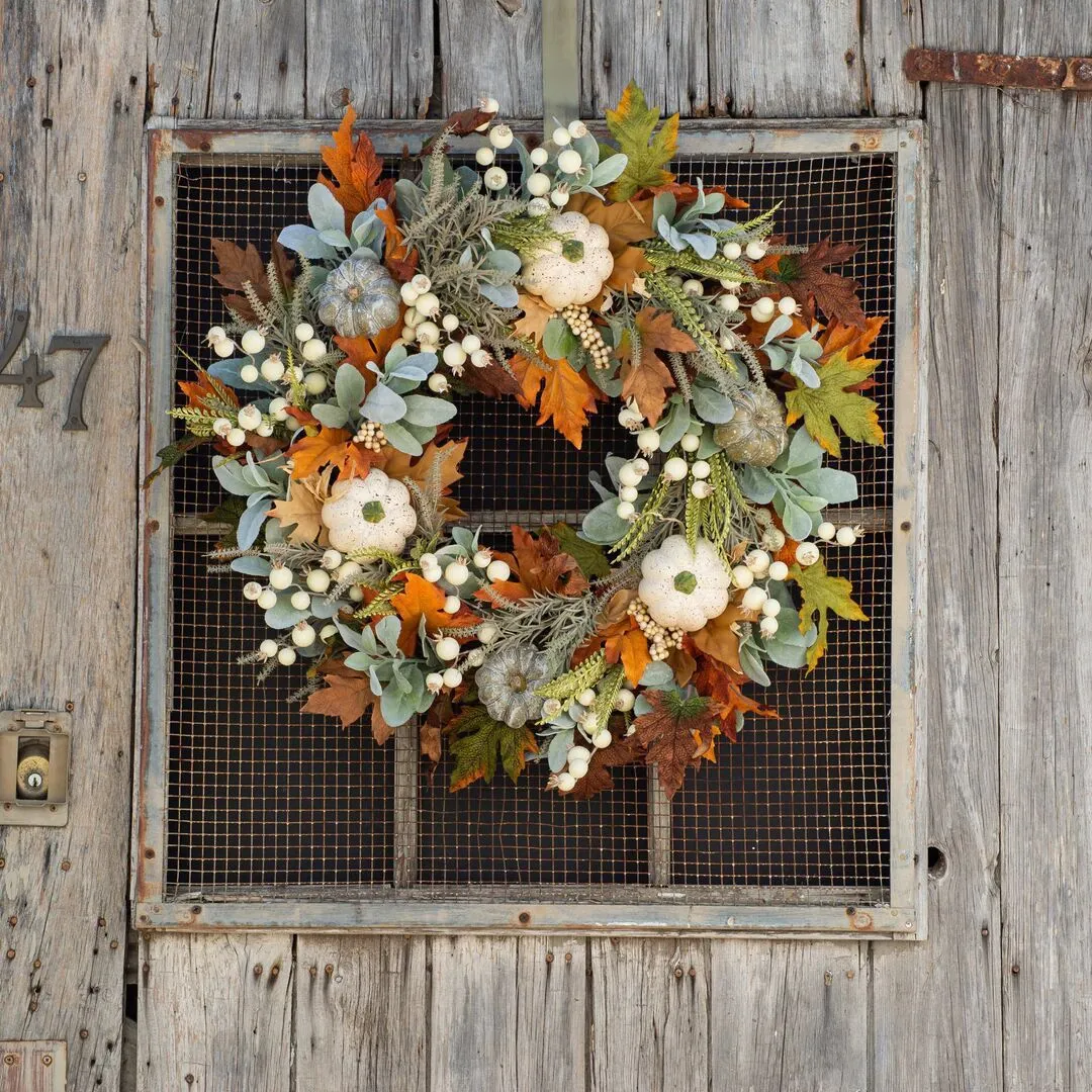 Pumpkin wreath with simulated frost leaves and pumpkins on a rattan ring base, 45x45cm size