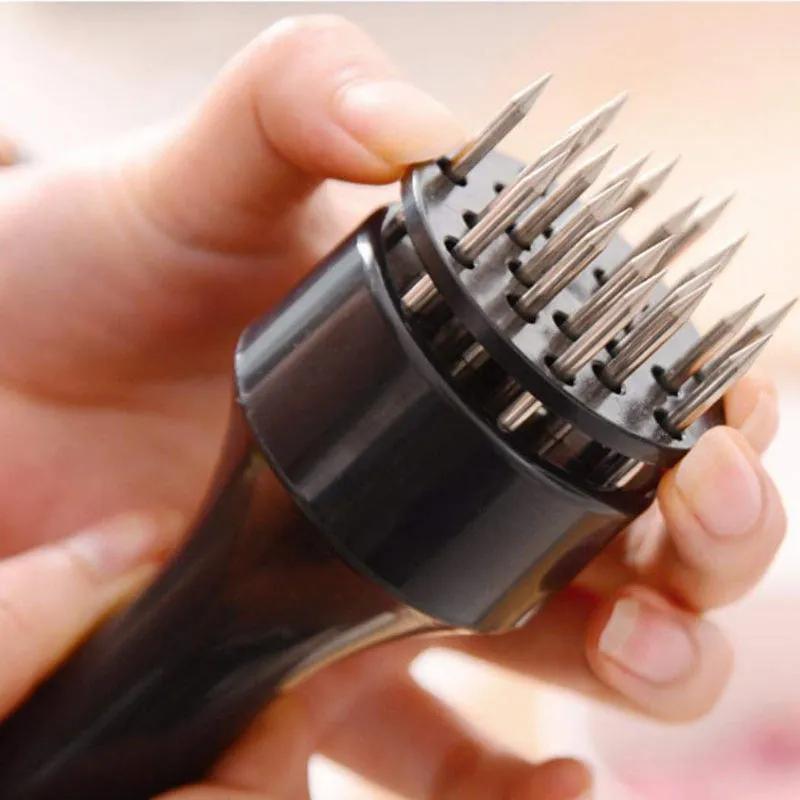 Pine meat needle tenderiser tool for steak with white handle and metal needles, shown on a kitchen surface