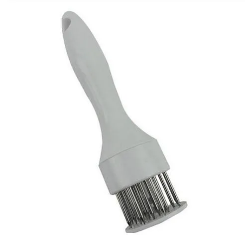Pine meat needle tenderiser tool for steak with white handle and metal needles, shown on a kitchen surface