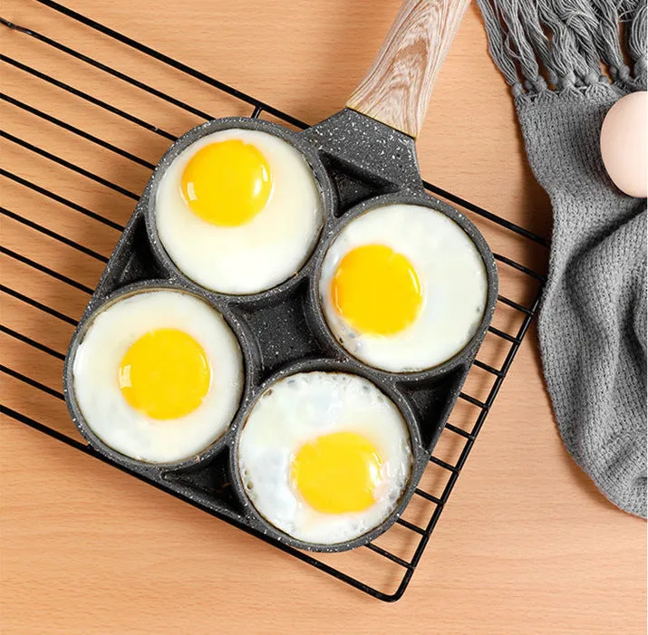 Non-stick egg dumpling frying pan in black aluminium with two holes for cooking breakfast burgers