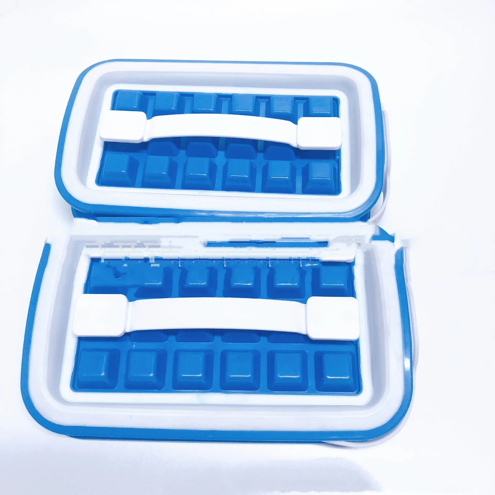 Blue silicone ice cube tray with 36 square cavities and a lid on a wooden table