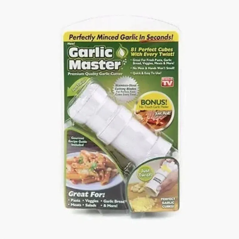 White ABS plastic garlic press with peeler on kitchen countertop
