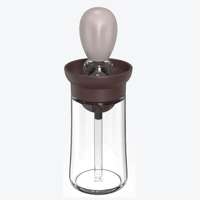Creative silicone brush head press metering oil bottle in red with glass body and silicone brush top for kitchen use