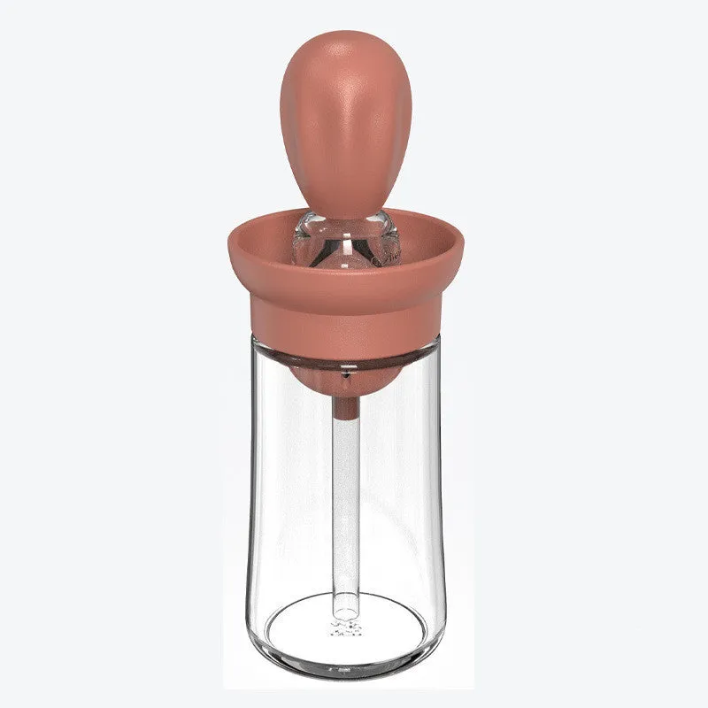 Creative silicone brush head press metering oil bottle in red with glass body and silicone brush top for kitchen use