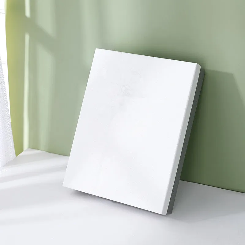 Large blue rectangular cardboard gift box with white base and bow on a plain background