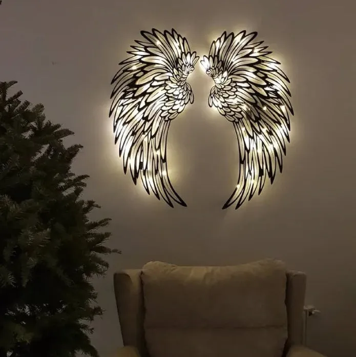 Carved metal wall decor with light, angel wings design, double-sided black iron, 35cm pair on a wall