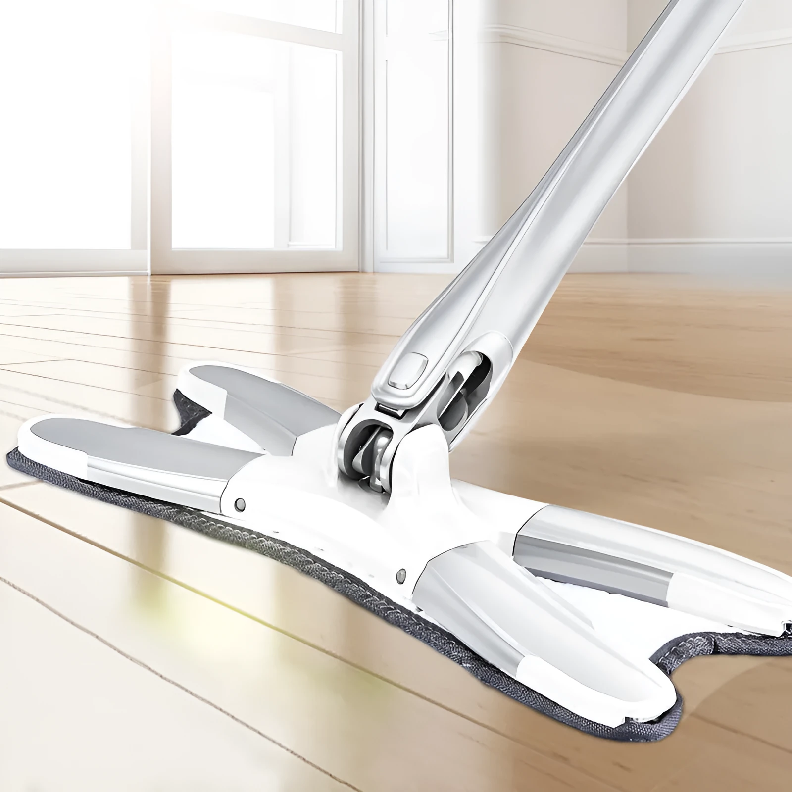 White hand-free flat mop with ABS head and metal pedal next to plastic basket
