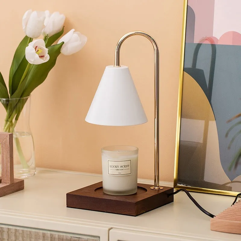 Wax melting lamp with oak wood base and white iron lampshade on a bedside table