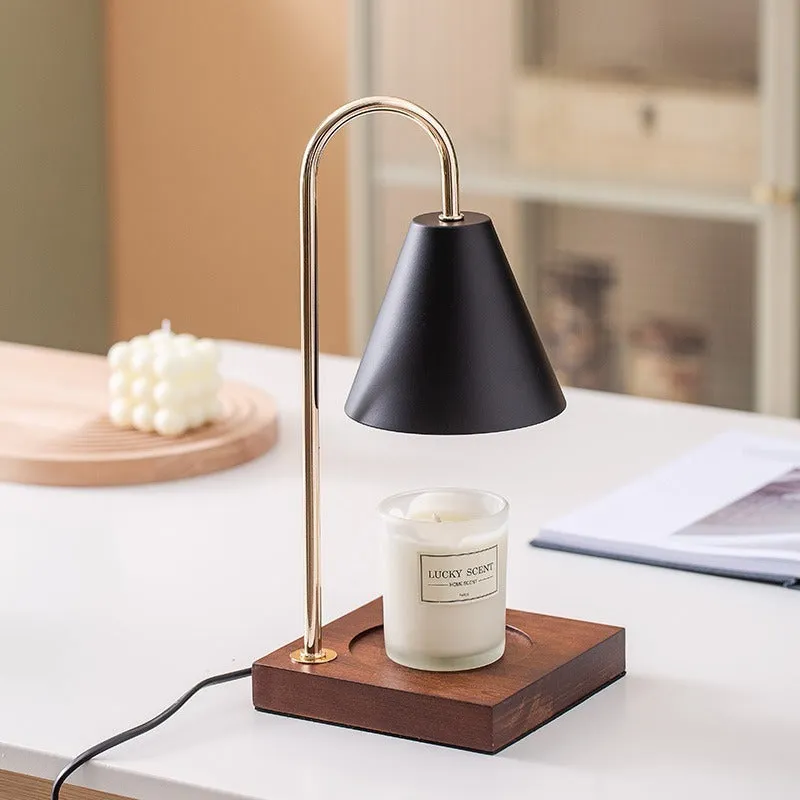 Wax melting lamp with oak wood base and white iron lampshade on a bedside table