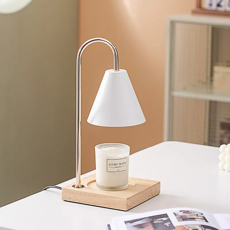 Wax melting lamp with oak wood base and white iron lampshade on a bedside table
