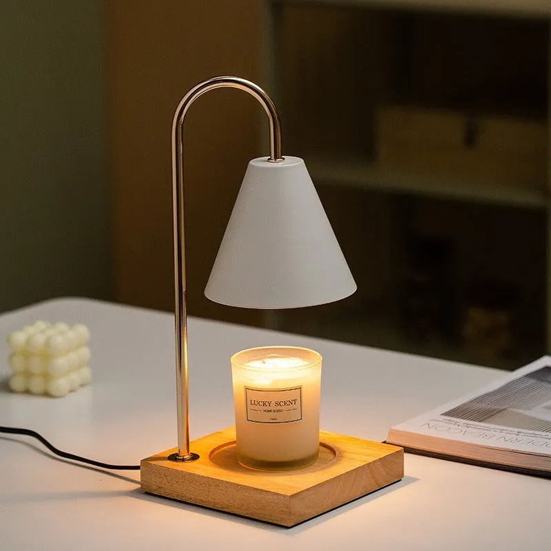 Wax melting lamp with oak wood base and white iron lampshade on a bedside table