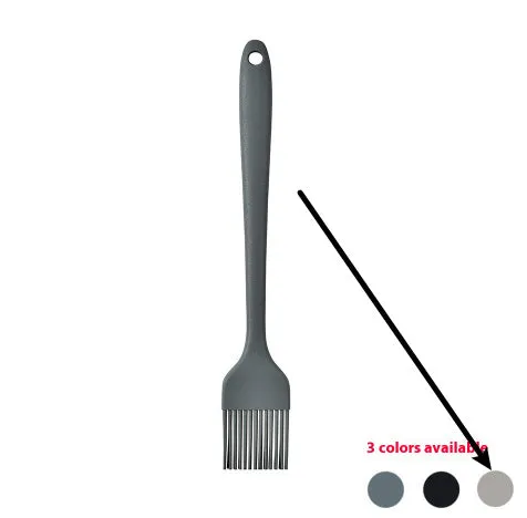 12-piece silicone kitchen utensil set in rotating storage bucket, including spatula, spoon, ladel, and egg beater on kitchen counter.