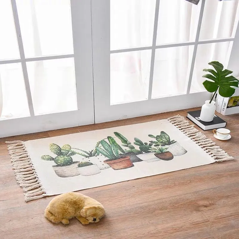 Handwoven cotton linen floor mat 60x90cm in ethnic style with natural plant dye, placed on a wooden floor