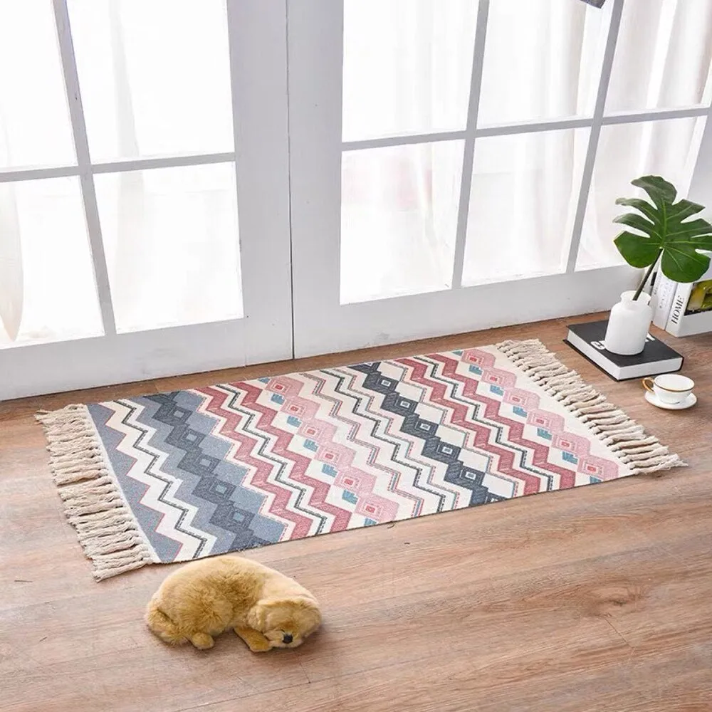 Handwoven cotton linen floor mat 60x90cm in ethnic style with natural plant dye, placed on a wooden floor