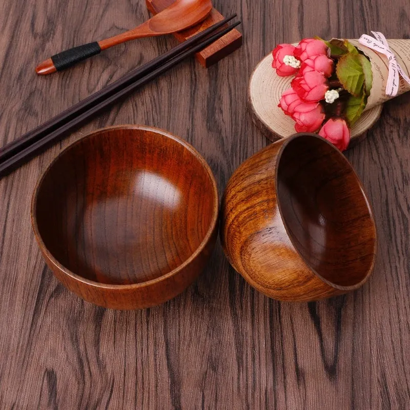 Set of four round wooden bowls in natural wood colour from 10x6.5cm to 11.8x6.7cm