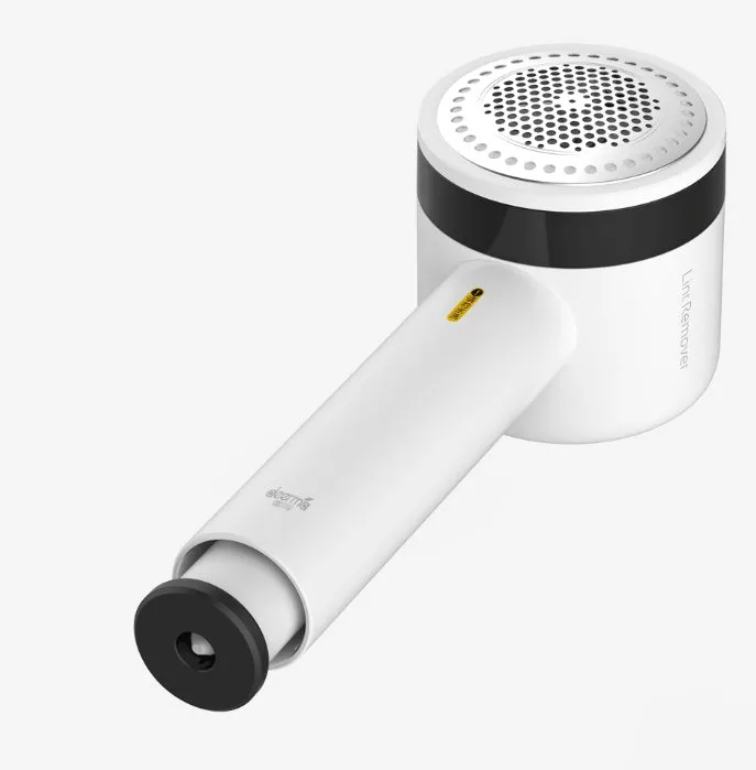 White rechargeable lint remover with hidden hair collection container and detachable three-blade head on white background