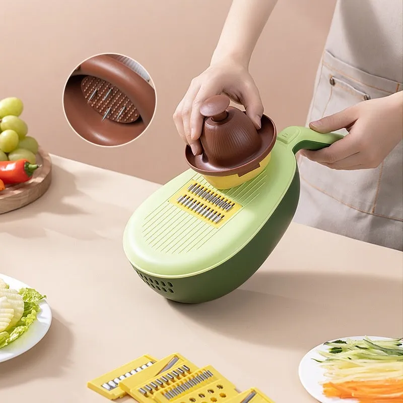 Avocado green vegetable grater with stainless steel blades on kitchen counter