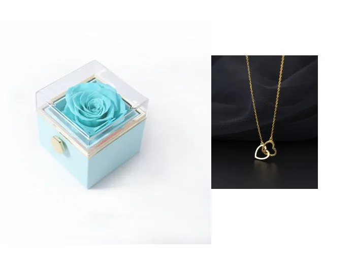 Acrylic rotating rose jewellery box in Chinese red with compartments for rings and earrings