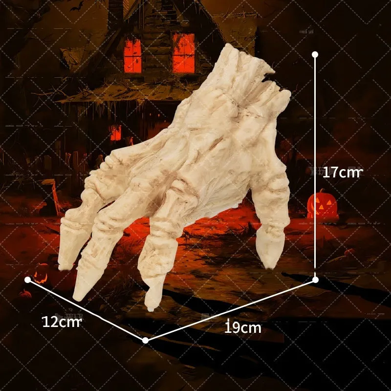 Halloween electric luminous crawling hand made of realistic vinyl with glowing lights on a floor