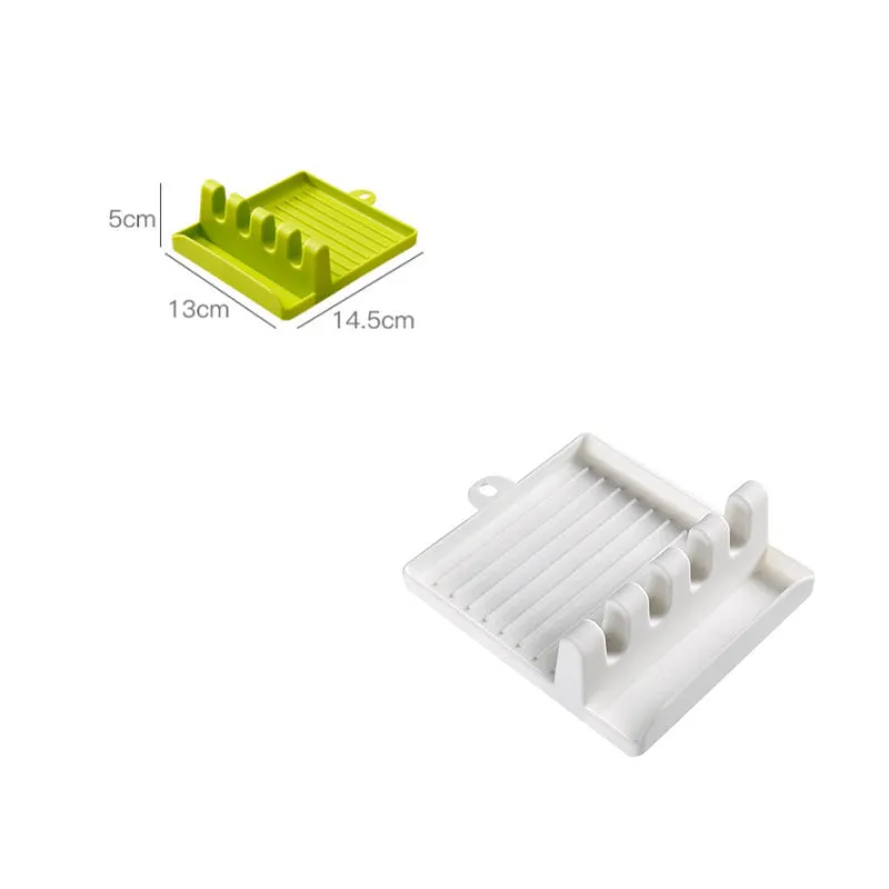 Green silicone kitchen utensil holder with four holes holding spatula, spoon, knife, and chopsticks on countertop