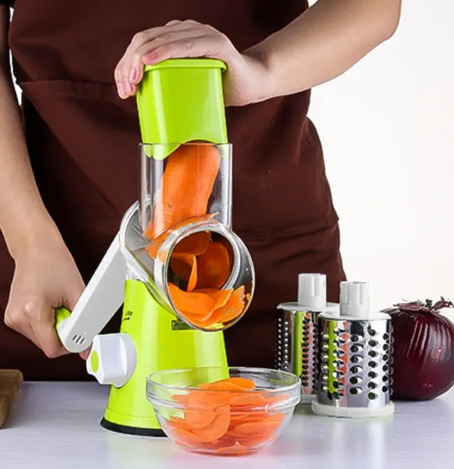Spiralizer 3-blade vegetable slicer with transparent barrel and red plastic body on white background