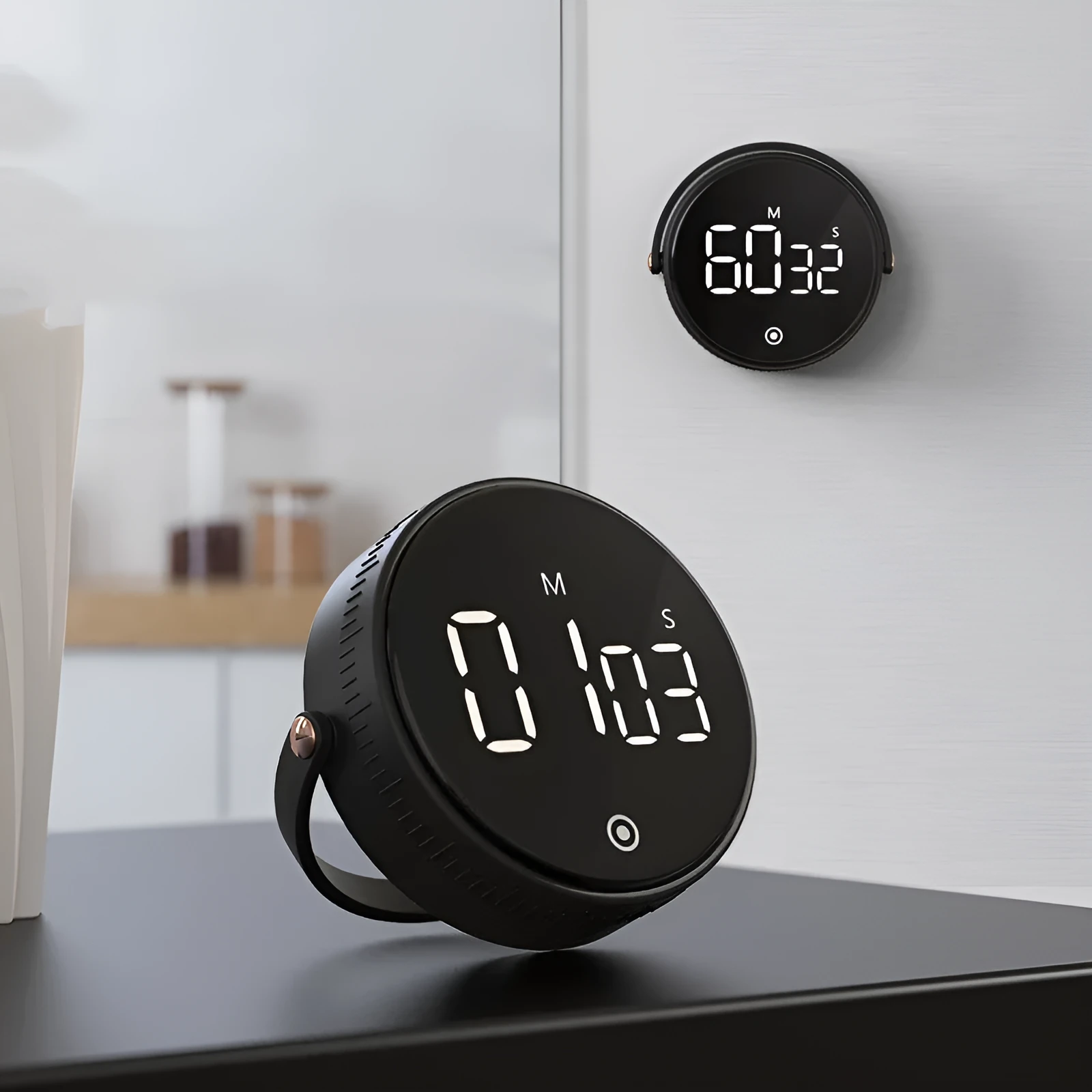 Black rotary digital timer with LED display showing 00:00, compact size