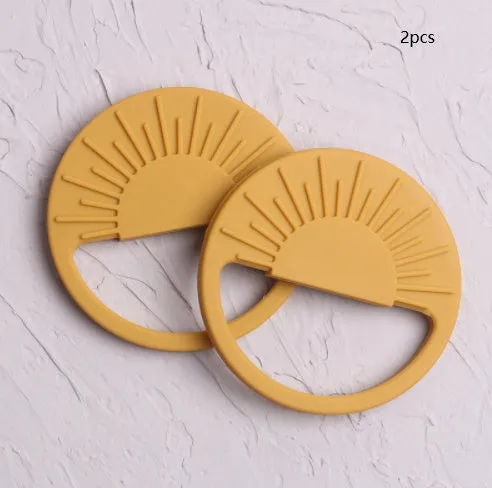 Silicone baby teether toy in multiple colours including pink and yellow, 88x88mm for infant teething relief