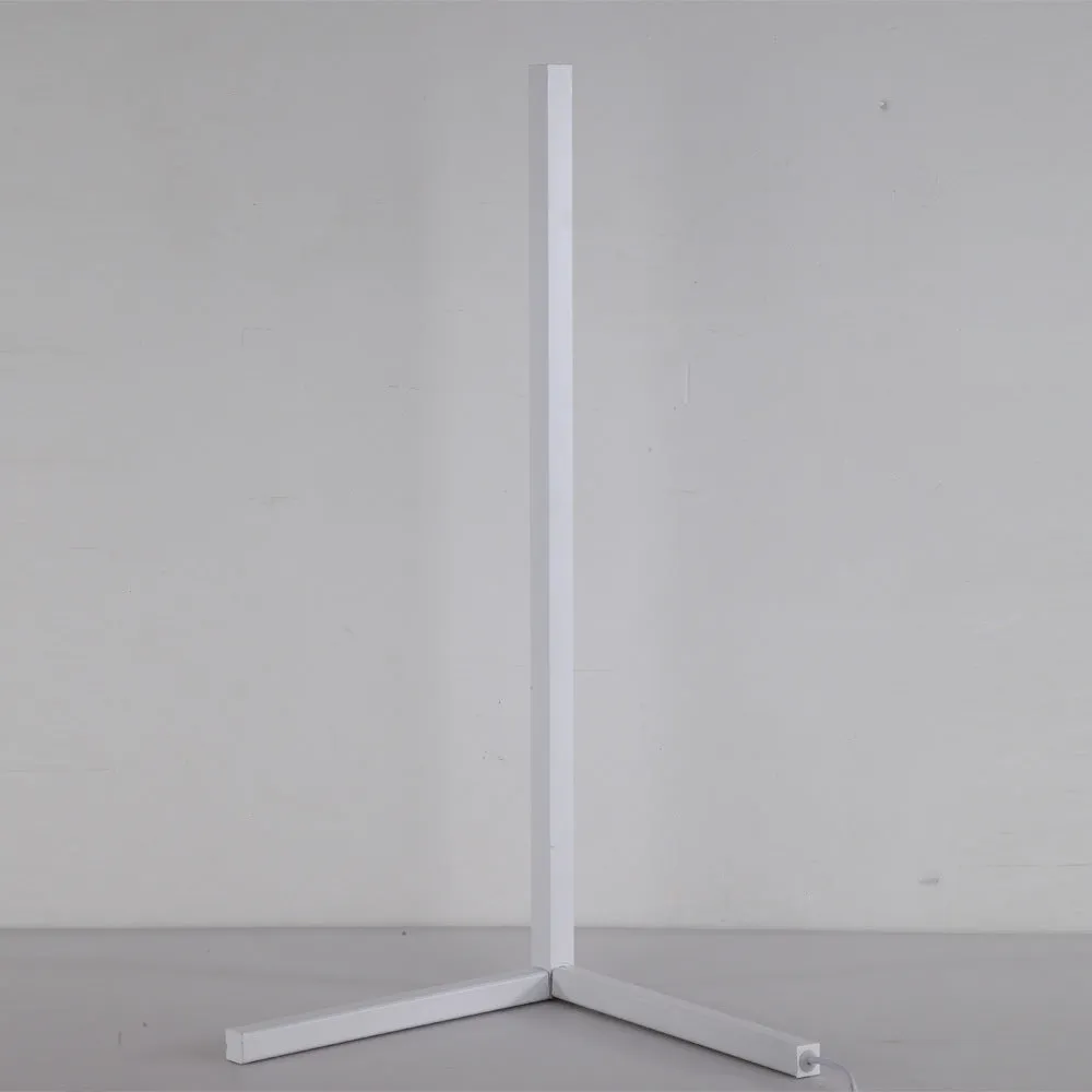 Nordic RGB corner floor lamp with aluminium shade, PVC body, remote control, 1.42m height, black finish against a light wall