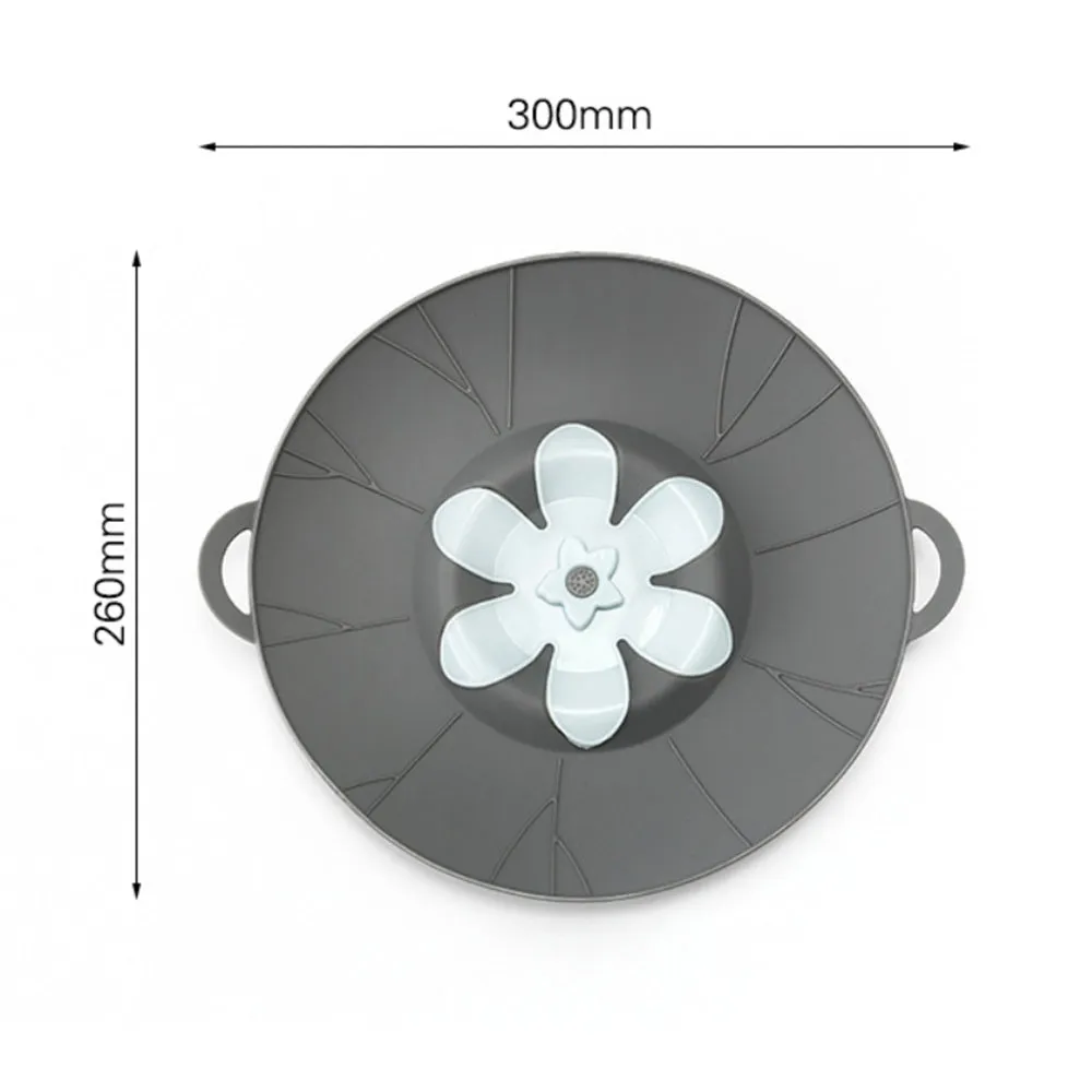 Silicone spill-proof pot cover in black, size 30x26cm, resting on a pot
