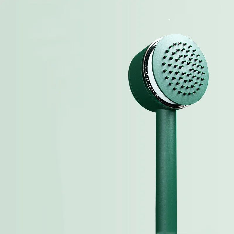 Plastic air cushion comb with long handle in white, green, and pink colours for hair detangling and styling