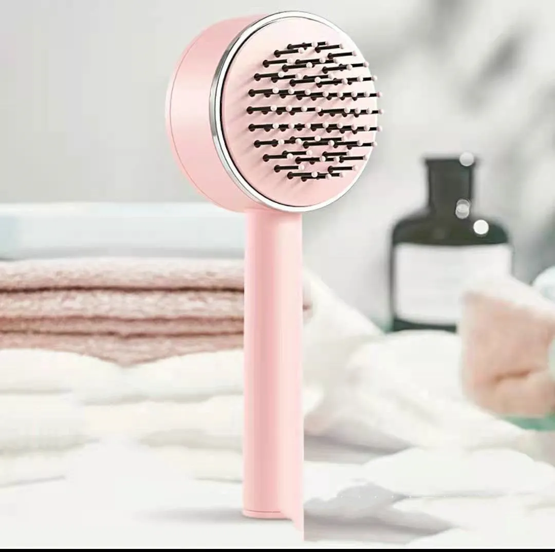 Plastic air cushion comb with long handle in white, green, and pink colours for hair detangling and styling