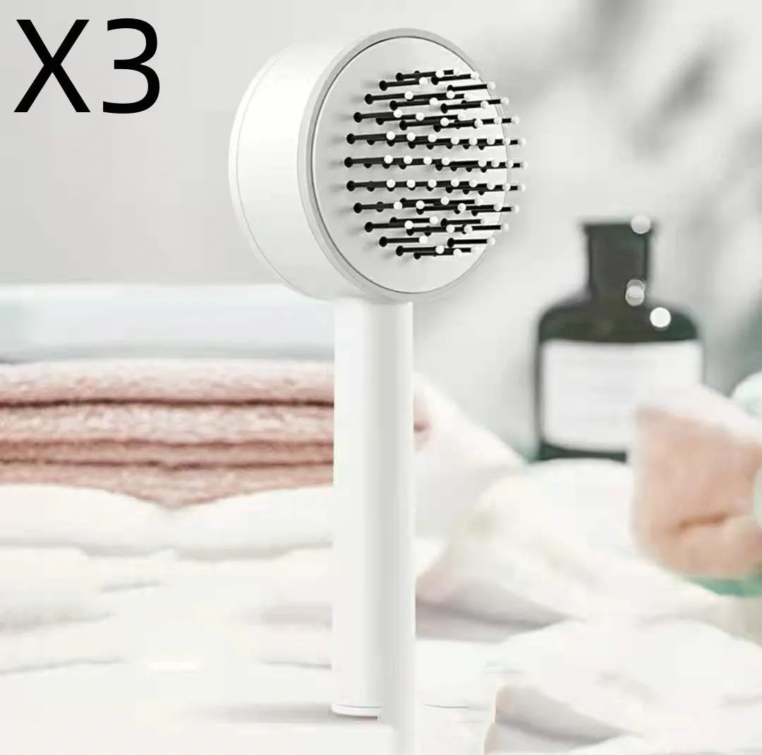 Plastic air cushion comb with long handle in white, green, and pink colours for hair detangling and styling