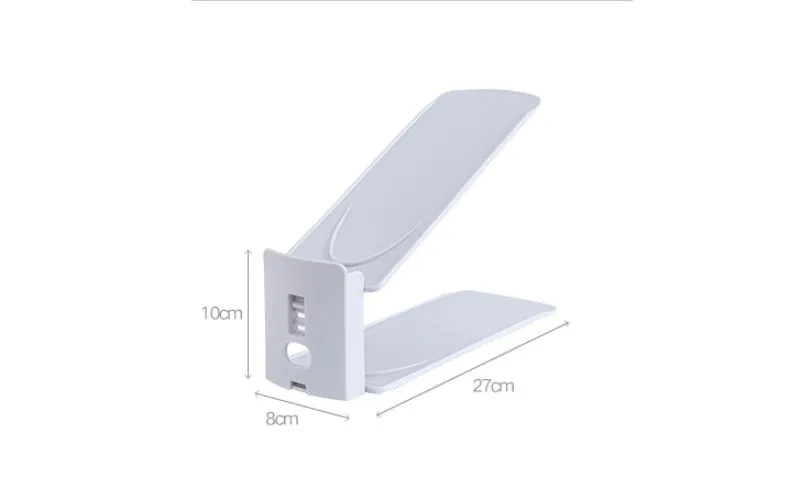 Double-layer adjustable shoe storage rack in white, holding two pairs of shoes